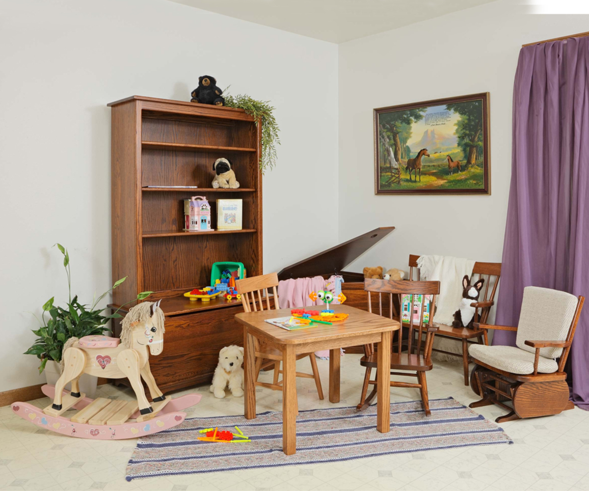 Exterior view of Heirloom Amish Furniture store, showing the storefront with signs and outdoor furniture displayed along the sidewalk.