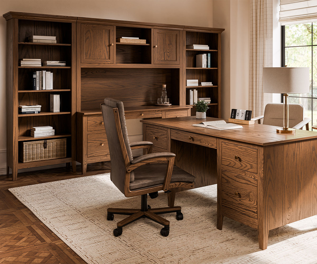 Bright bedroom featuring solid wood furniture, including a canopy bed, nightstand, chest, and dresser with mirror, all in a light natural finish.