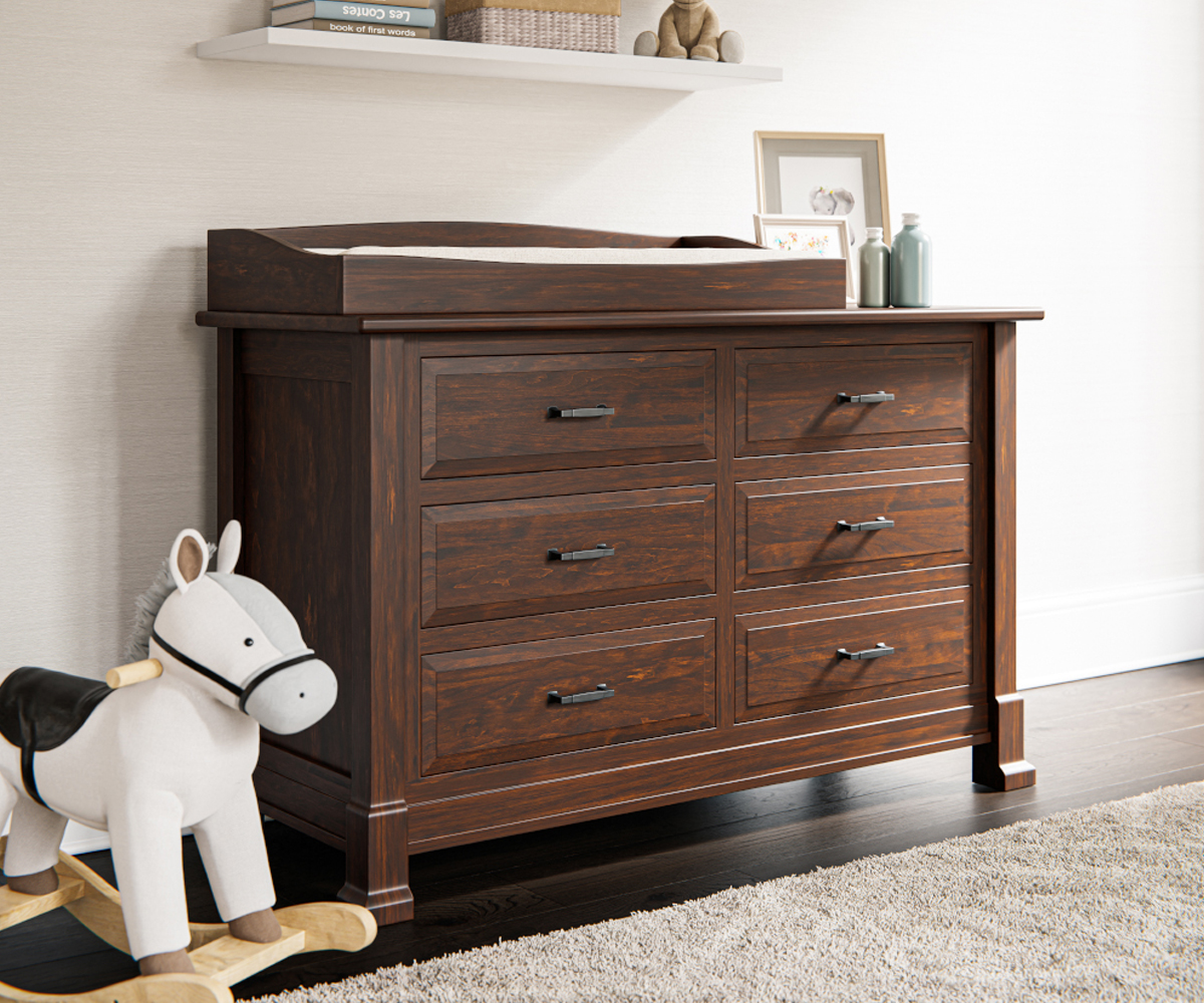 Exterior view of Heirloom Amish Furniture store, showing the storefront with signs and outdoor furniture displayed along the sidewalk.